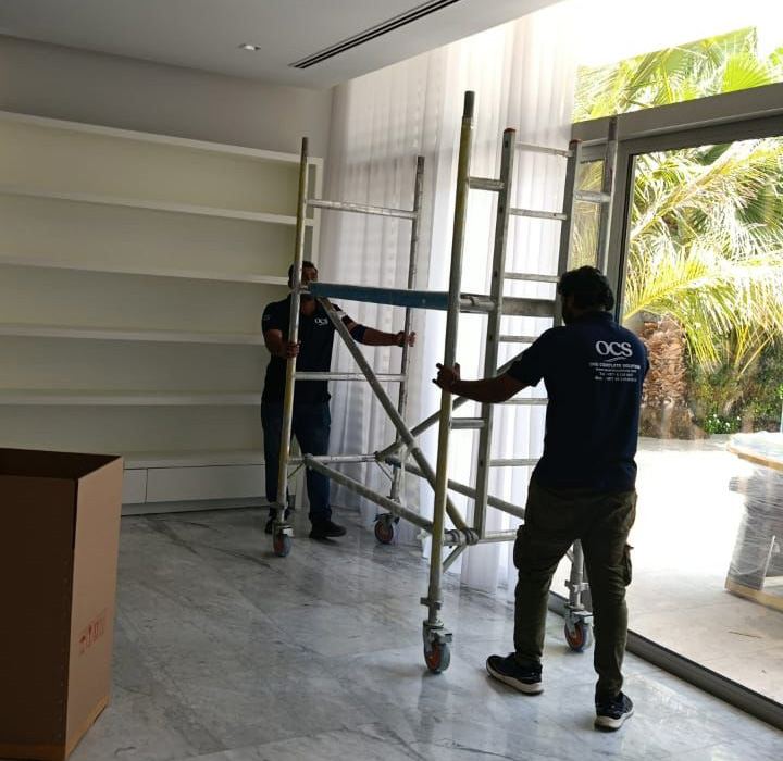 OCS Relocations moving crew packing household items in Dubai